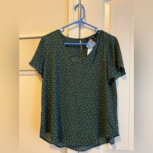 Cute green blouse with white polka dots.